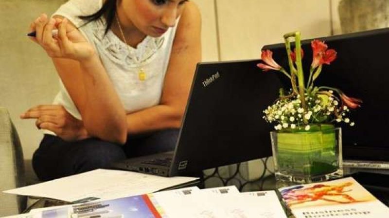 Woman Writing a CIPD Assignment