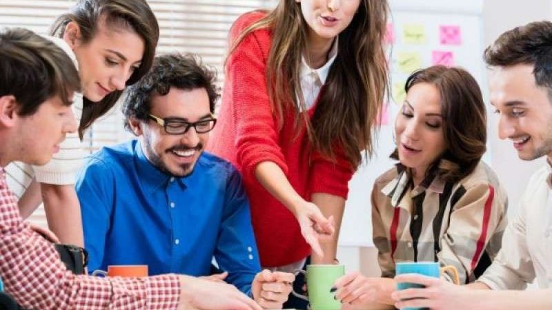 Happy team working together in UAE