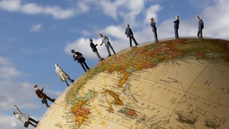 People walking on a globe