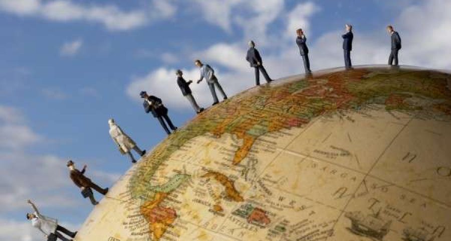 People walking on a globe