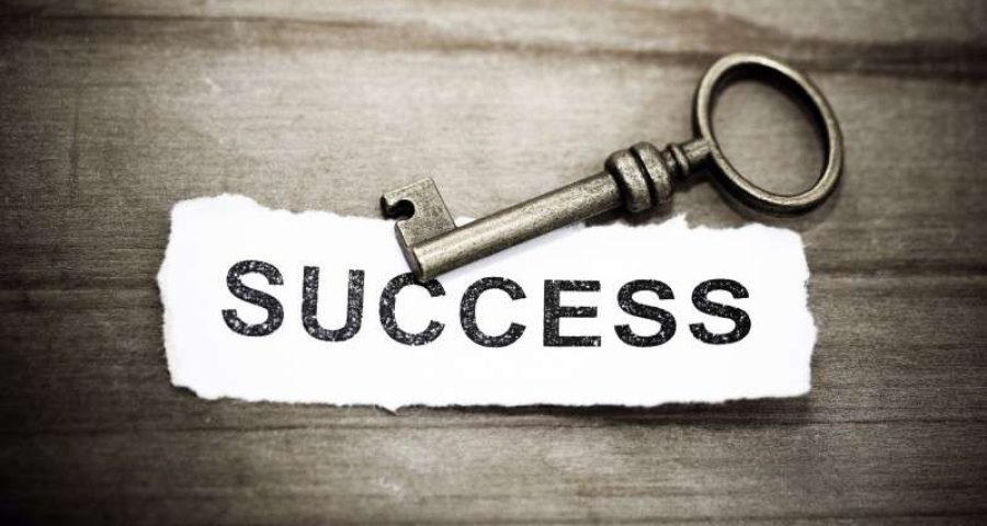 a Key and paper saying success